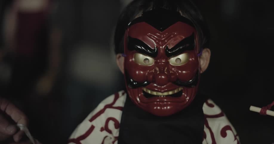 A child wearing a mask outdoors