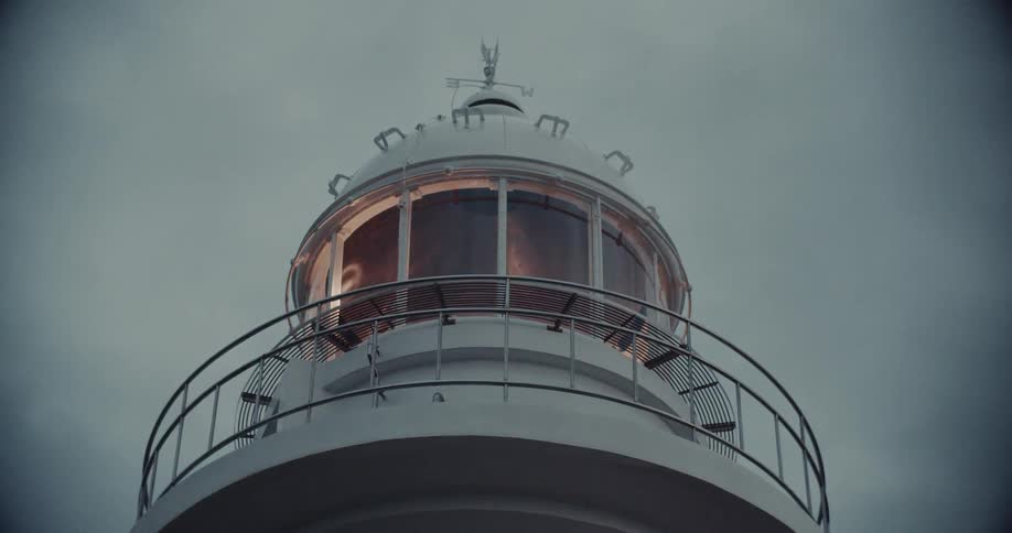A view of a lighthouse at night