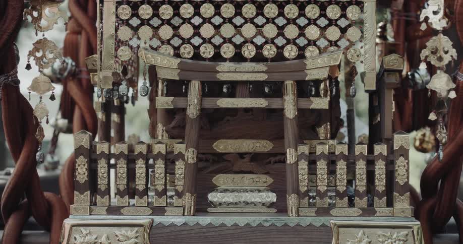 Japanese portable shrine with golden carvings and ceremonial ornaments