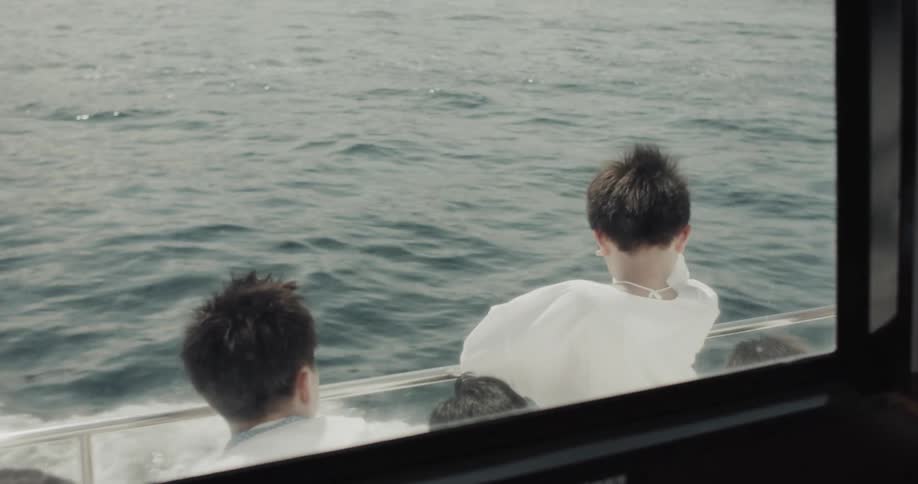 People are looking at the water as they ride the ferry