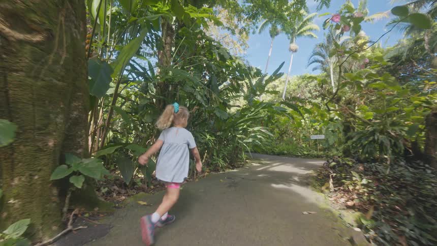 The girl is running on the trail