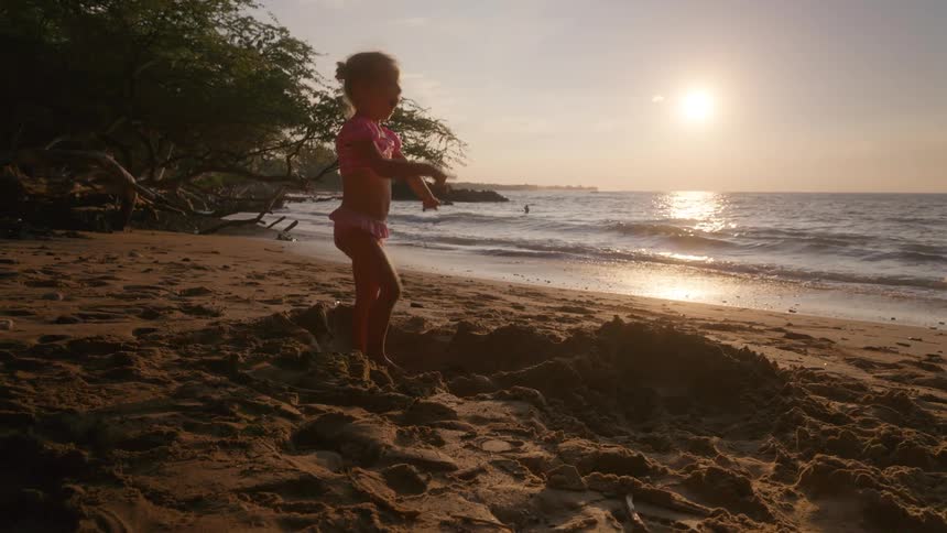 A girl playing at the beach