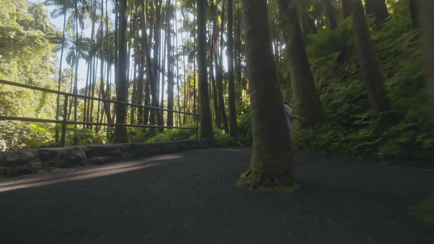 The girl races on the tropical trail