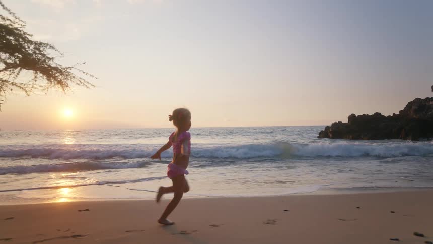 A view of a child running outdoors on a day