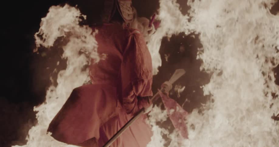 A person walking through a bonfire