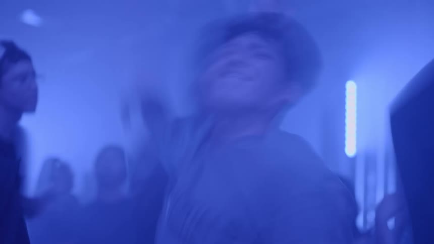 A group of people dancing in a club