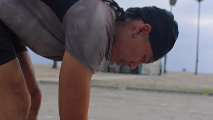 Man stretching his body outdoors