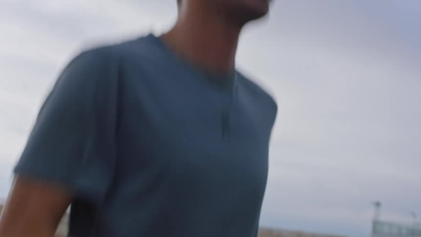 Man concentrating warming his body outdoors