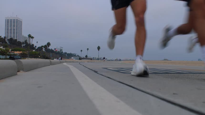 Three people running outdoors