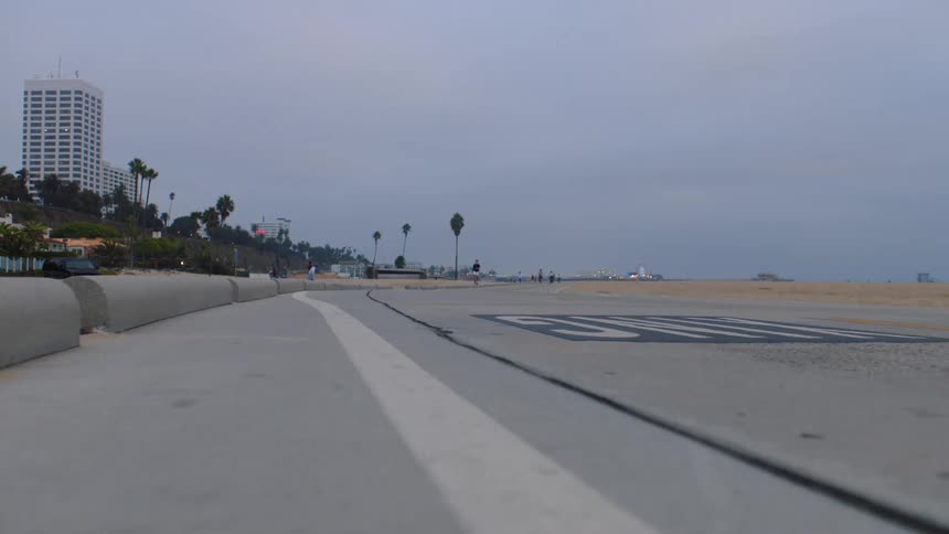 Paved area for pedestrians along the edge of the beach sand