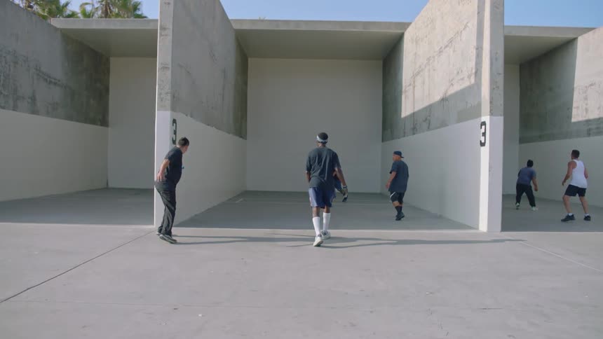 Group of men training sports on partitioned walls