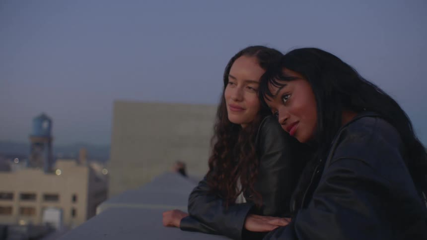 A portrait of two women at dusk