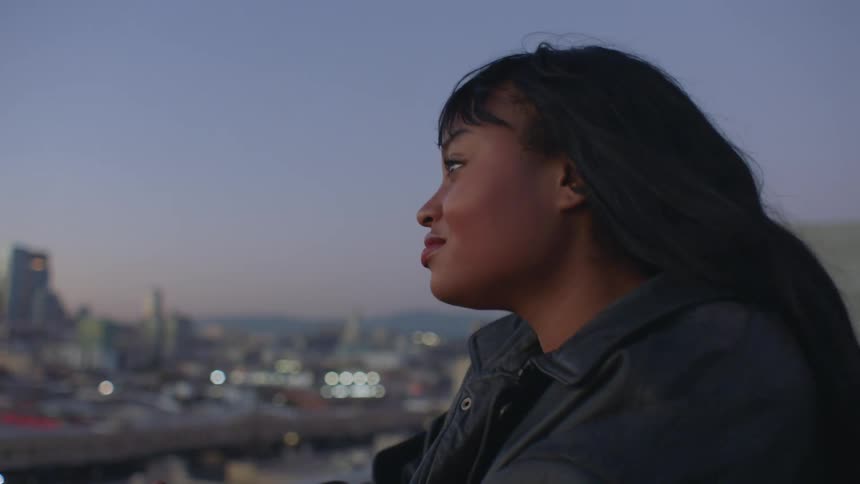 A woman looking out over a city