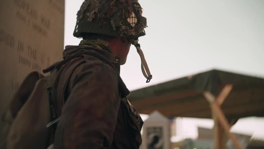 A soldier pointing into the distance