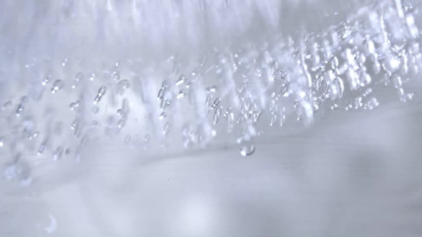Translucent ice with elongated bubbles concentrated near the surface