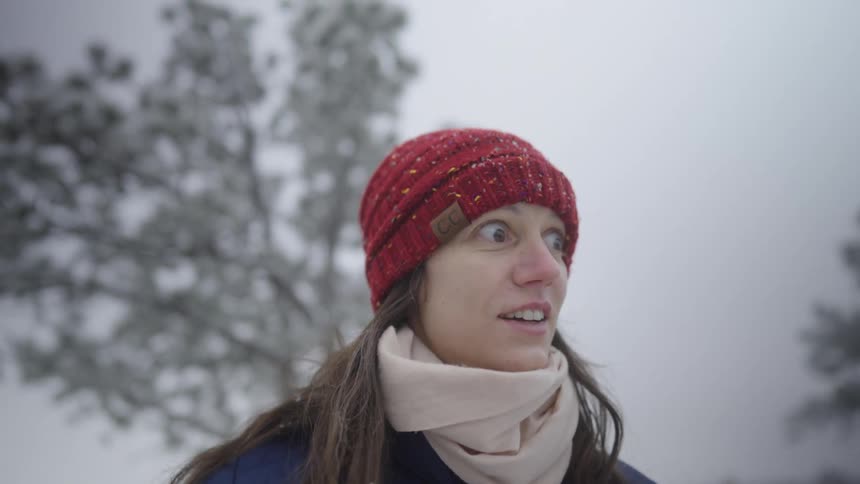 Woman in red hat in the snow