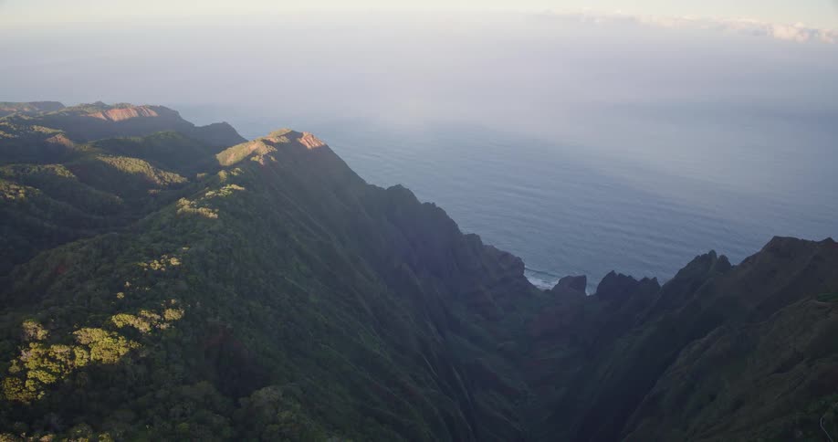 The large mountain range is by the water