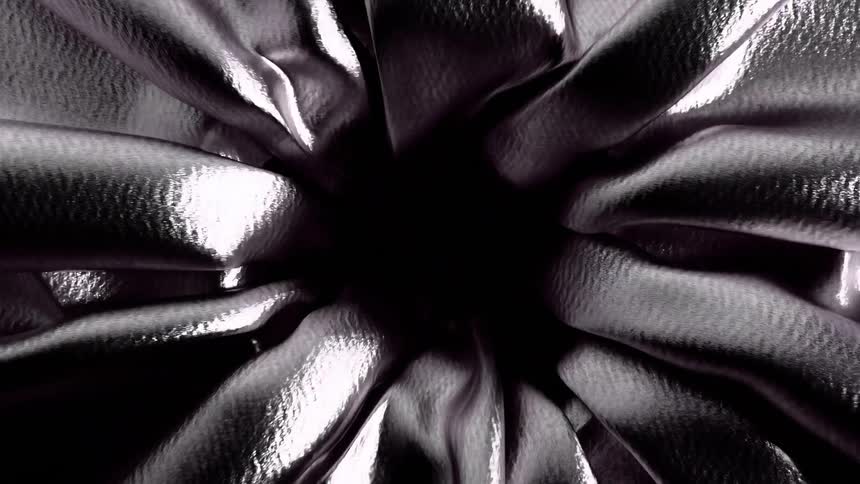 The metallic sheet is pulled into the hole