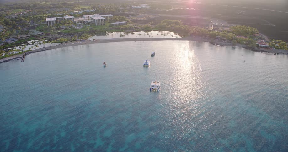 An aerial view of boats at the coast