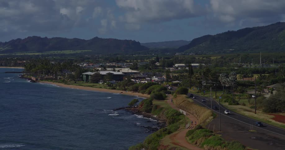 An aerial view of a road along a coast