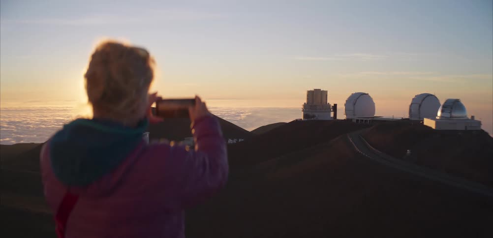 A woman looking at an observatory