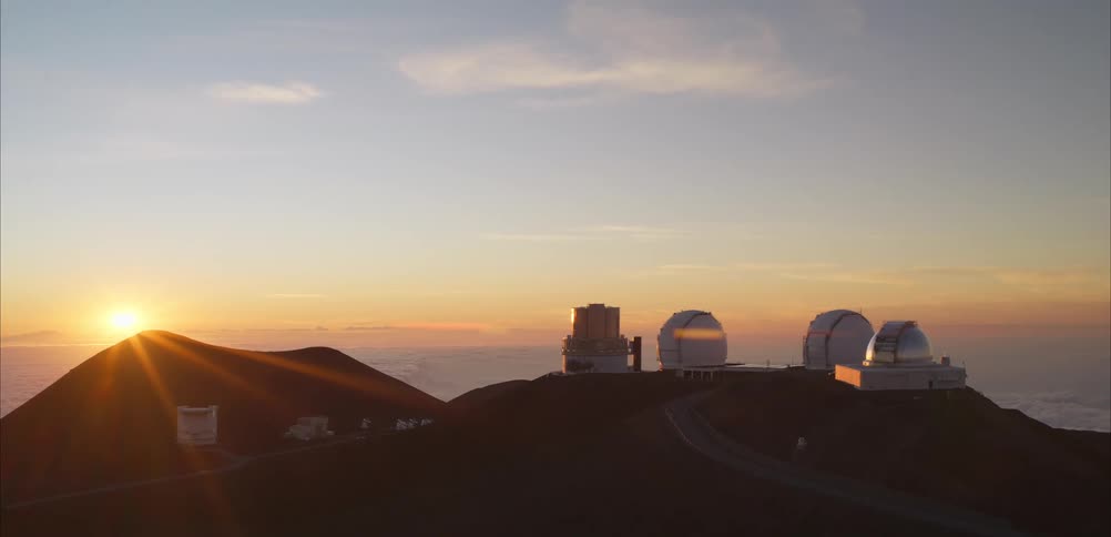 Planetariums and observatories on the mountain peak with the sunrise on the horizon