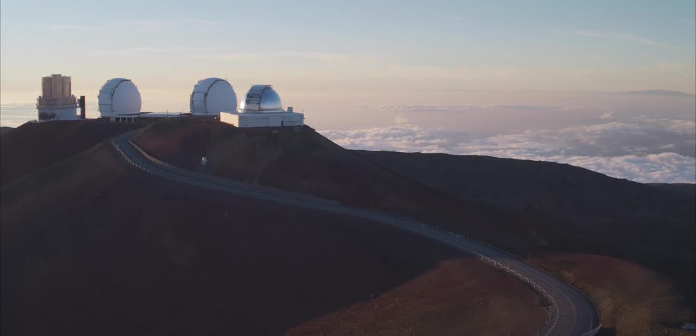 A large telescope is on the mountain top