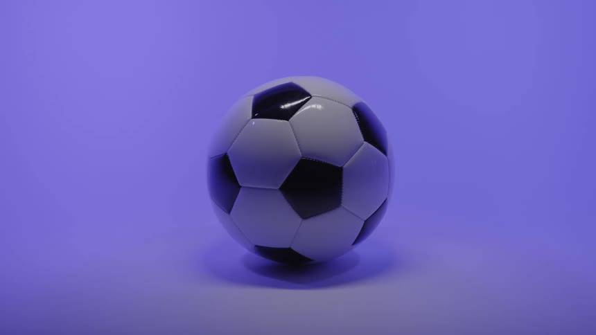 Soccer ball on the floor of a room with a purple glow