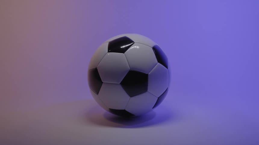 Soccer ball on the floor of a room with a lavender glow