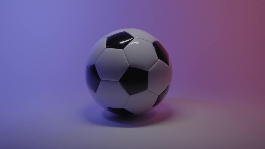 Soccer ball on the floor of a room with a glowing light changing colors