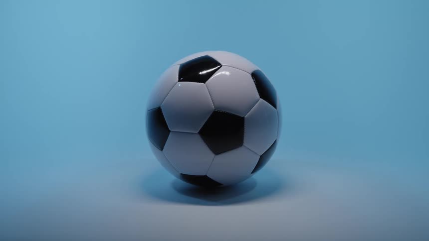 Soccer ball on the floor of a room with a light blue glow
