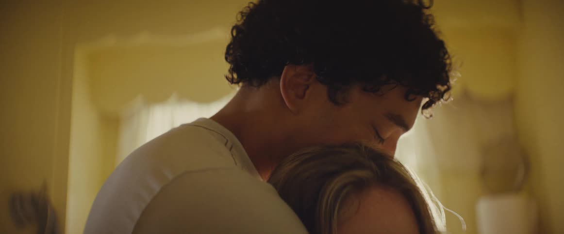 The man hugs the sad woman