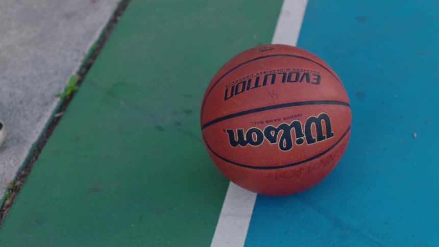 Basketball sitting on the basketball court