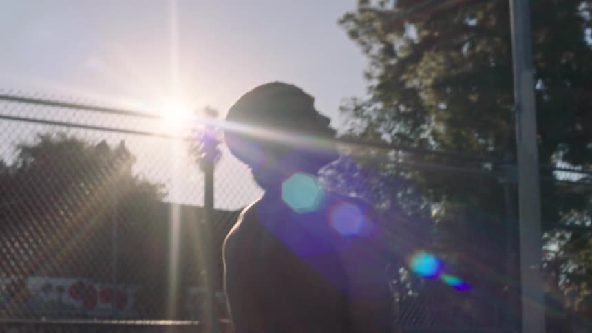 The man shoots the basketball
