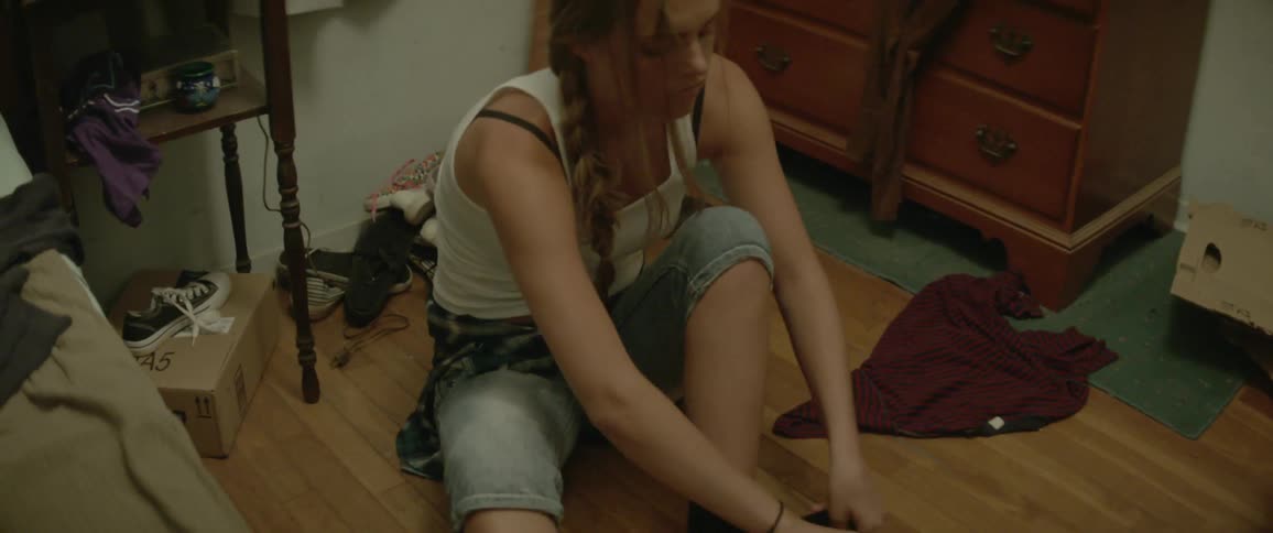 A girl puts on her shoes