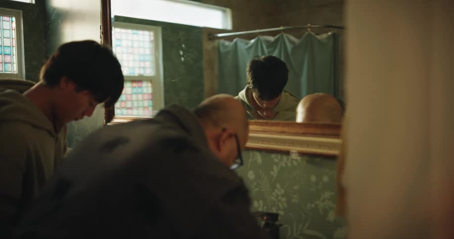 Asian father and teenage son preparing together in the bathroom during daytime