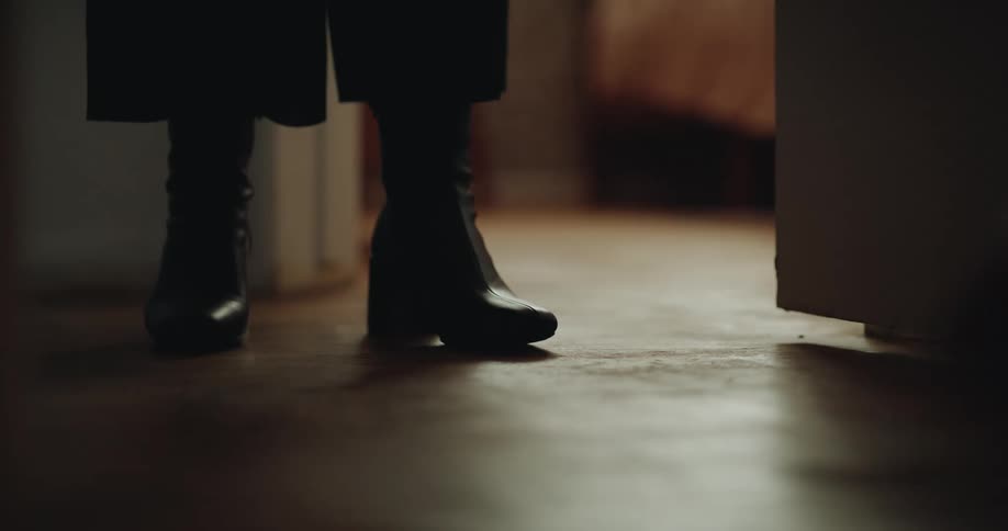 A view of peoples shoes in a house