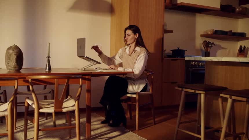 A woman using a computer in a room