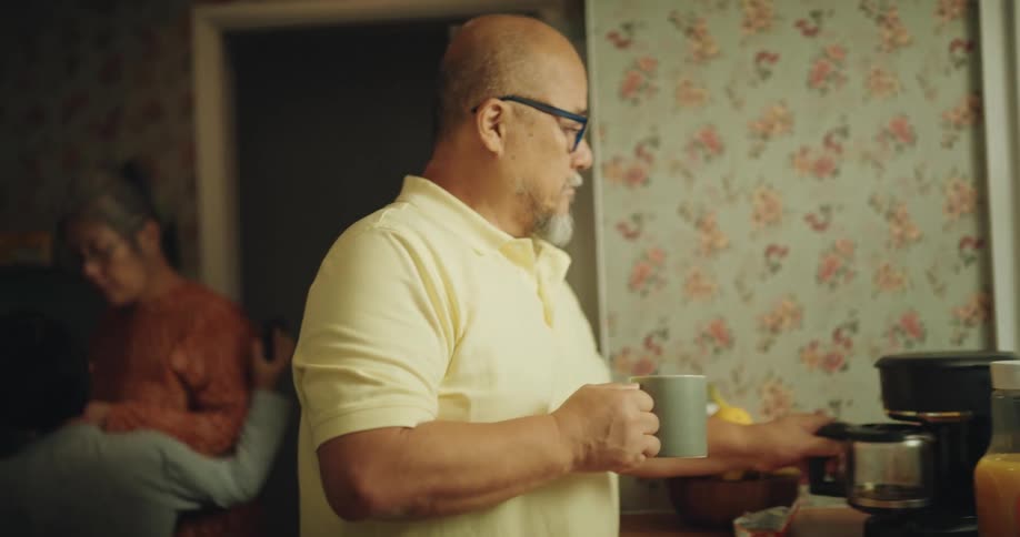 The family get ready for their day in the kitchen