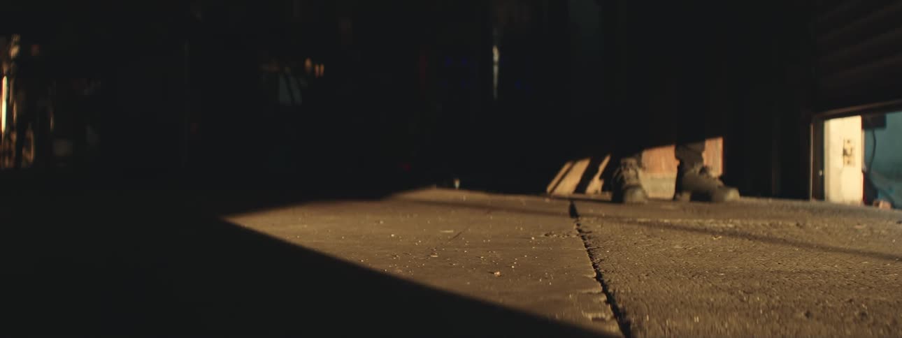 A garage door closing on a building