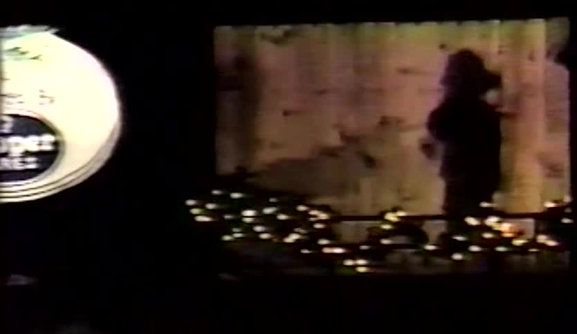 Elaborate christmas display contains statues and lights at night
