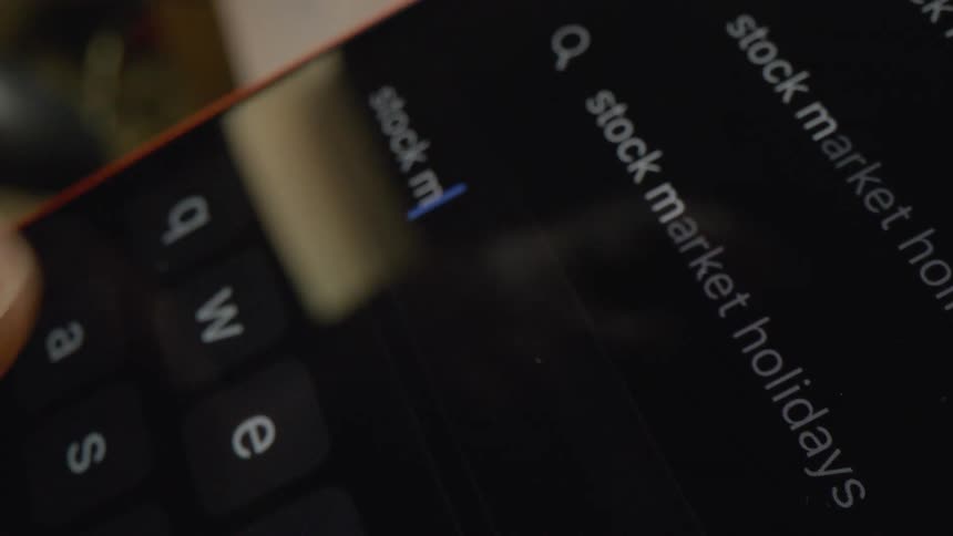A close up of a person typing on a smartphone