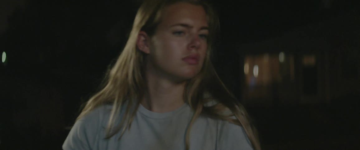 Disappointed woman walks in the dark
