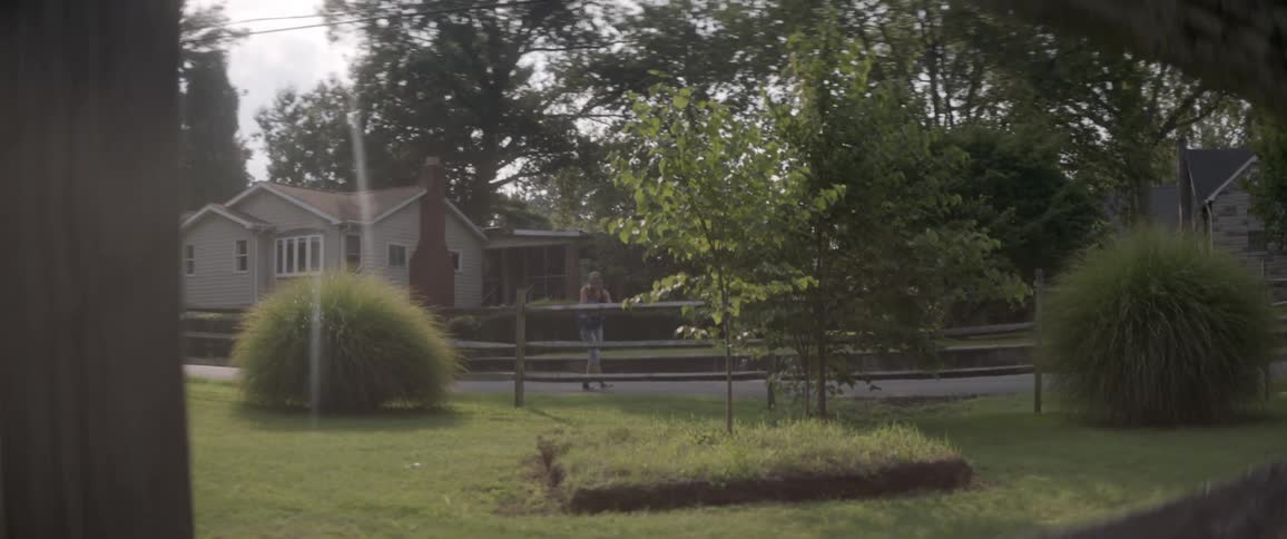 A woman walks in a residential area