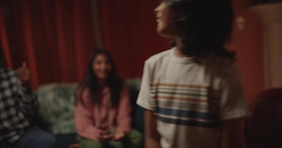 Adults and children playing charades