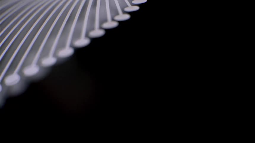 A view of some metal items on a lamp