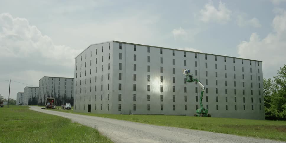 Large buildings are lining this small road
