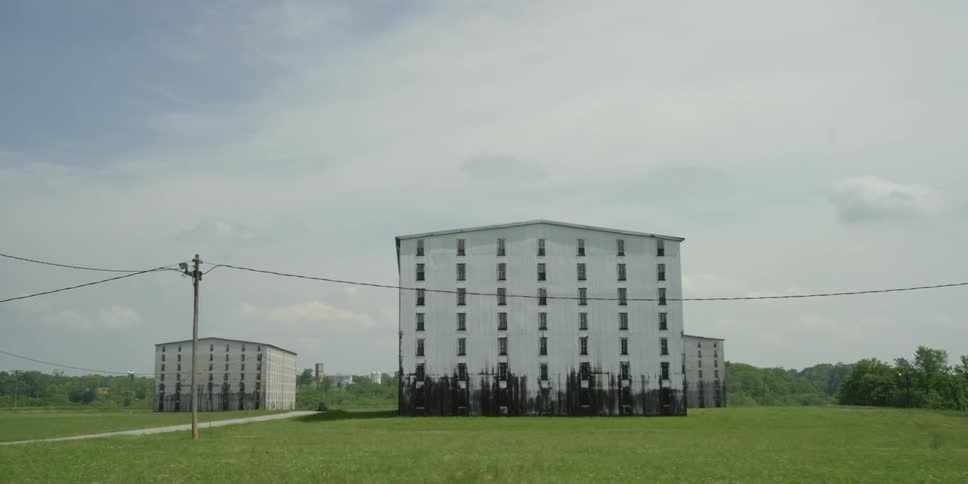 White buildings in the middle of a field