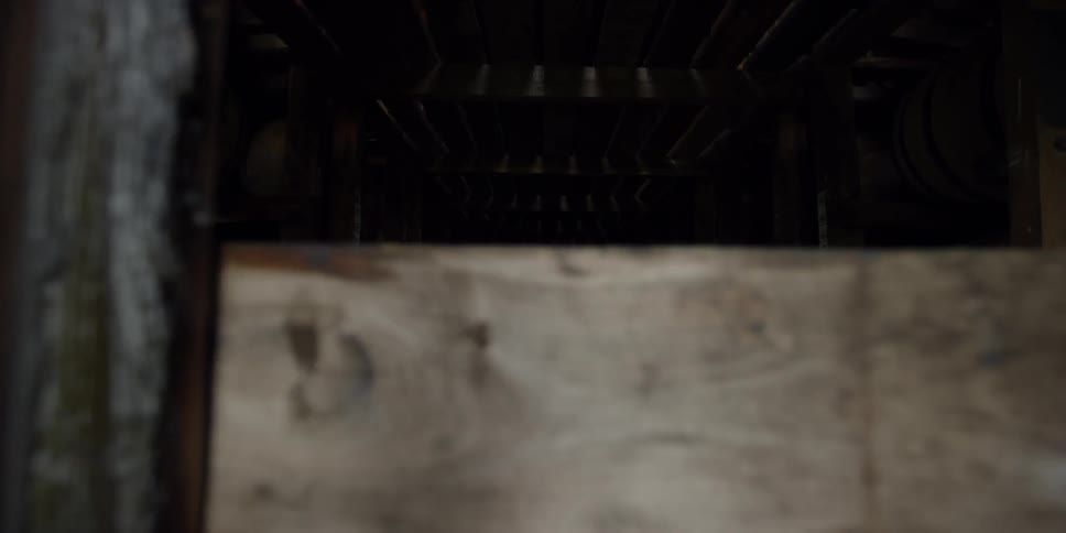 Under the boards is a dark tunnel