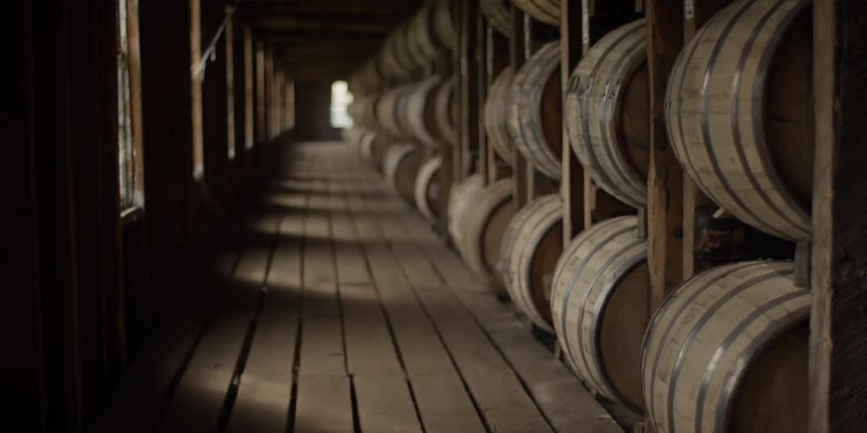 The hall is lined with large barrels